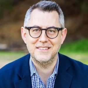 Albertson-Headshot-e1765906445627